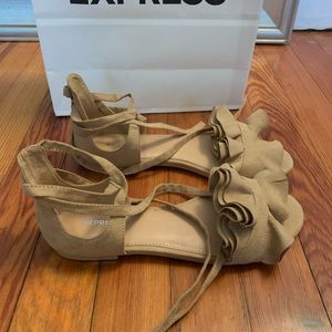 Faux suede taupe flat sandals. Wrap around style.
